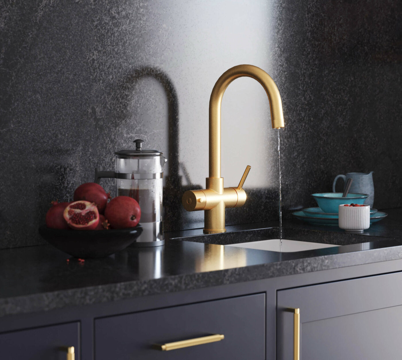 A gold boiling water tap with swan neck running water in dark modern kitchen
