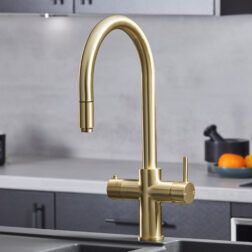 a swan neck pull-out hot water tap in gold