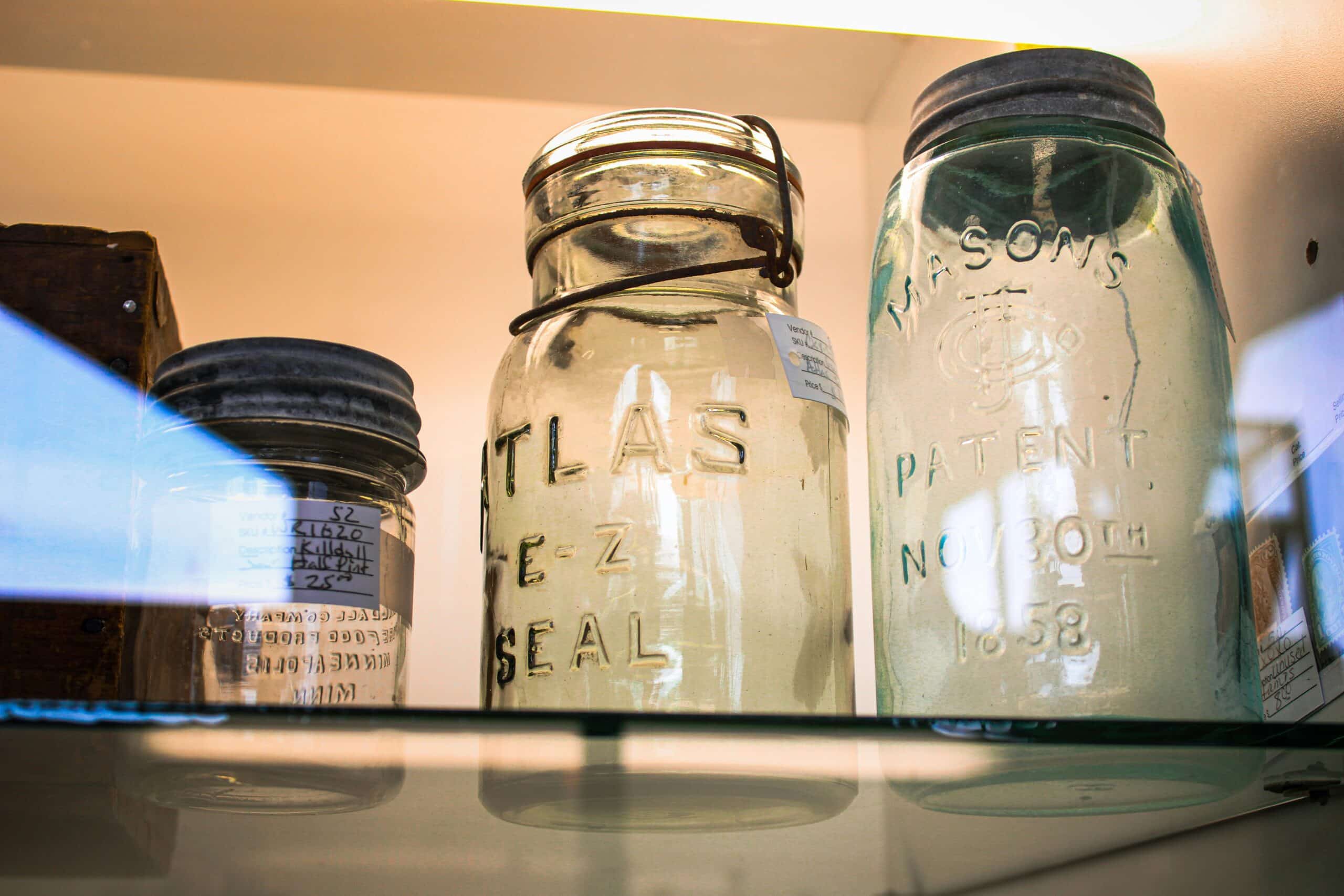reused mason jars in a fridge.