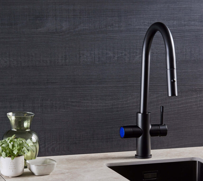 Matt Black sparkling tap in a modern kitchen with grey walls